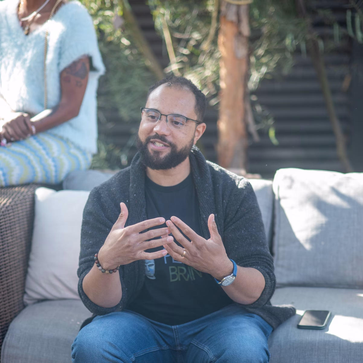 David Washington smiling in a natural outdoor setting, representing The Planted Brain’s focus on growth, connection, and mental well-being.